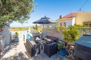 a villa with a swimming pool and a patio at Villa Leonie, private pool, jacuzzi, 8p in Orba