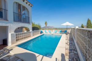 a swimming pool in front of a house at Villa Leonie, private pool, jacuzzi, 8p in Orba