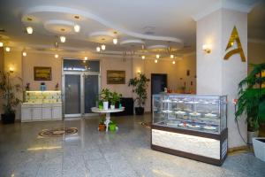a large room with a display case in a building at Anatolia Hotel Baku in Baku