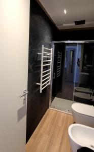 a bathroom with a toilet and a staircase in a room at Th Luxury Central in Catania