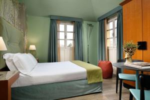 Postel nebo postele na pokoji v ubytování Villa Appiani Hotel