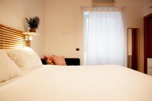 Cama ou camas em um quarto em Reale House Rooms