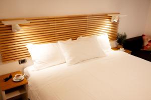 Cama ou camas em um quarto em Reale House Rooms