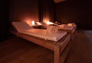 Postel nebo postele na pokoji v ubytování B&B Quattro Stagioni Charme and Wellness