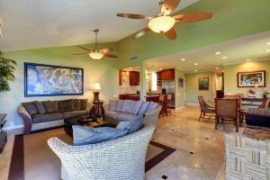 a living room with a couch and a dining room at WAILEA ELUA, #1204 condo in Wailea