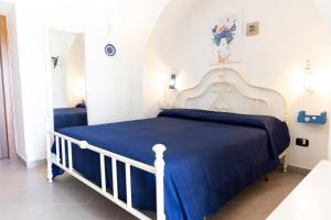 Ένα ή περισσότερα κρεβάτια σε δωμάτιο στο Tenuta Fontò