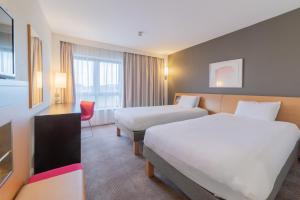 Ліжко або ліжка в номері Novotel Southampton