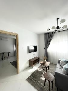 a living room with a couch and a table at Sigma Base Apartments in Lagos
