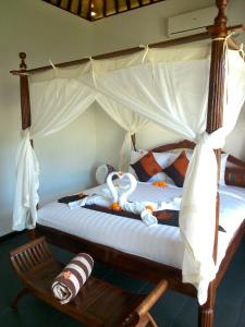 Ліжко або ліжка в номері Uma Kama Villa
