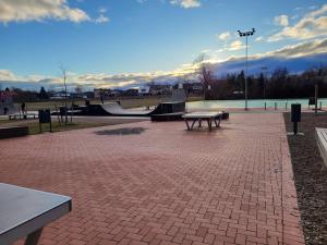 a park with a picnic table and a skate park at Luxury Apartment Private House and Parking Netflix in Tartu