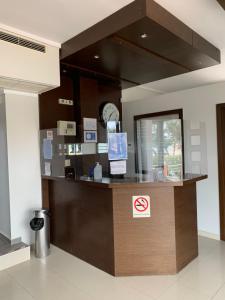 a no smoking sign on a counter in a building at Perea Hotel in Perea