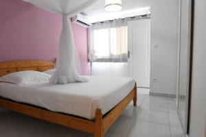 Postel nebo postele na pokoji v ubytování Ti K'Line - Grand Appartement de standing aux Trois Ilets