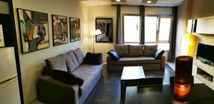 a living room with two couches and a table at 2V LUXURY APARTMENT NEAR BEACH in Puerto del Rosario