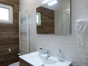 a bathroom with a sink and a mirror at HOME SWEET HOME in Sammichele di Bari +57 photos