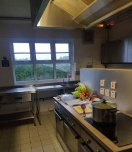 a kitchen with a sink and a counter top at Cunninghame 2 in Beith