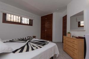 A bed or beds in a room at Beach View
