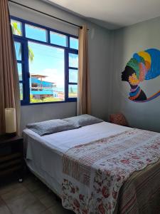 Un pat sau paturi într-o cameră la Soul Hostel Natal