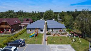 an aerial view of a park with a playground at Mielenko Domki Wakacyjny Raj in Mielenko