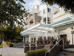 a large white building with stairs in front of it at Fremont 1BR w wd gym pool nr Tesla SFO-1123 in San Mateo