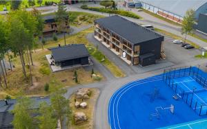 an aerial view of a building with a swimming pool at Eerikkilä Sport & Outdoor Resort in Tammela