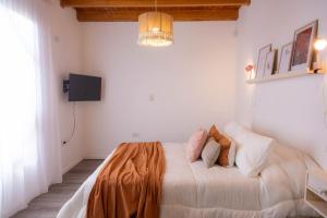 a bedroom with a large bed in a room at Mamma, Esquel. in Esquel