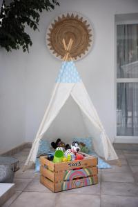 a toy tent with stuffed animals in it at Casa Hibiscus Marbella in Marbella