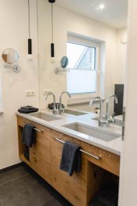 Kuchyň nebo kuchyňský kout v ubytování Küsten Apartments Tannenhausen