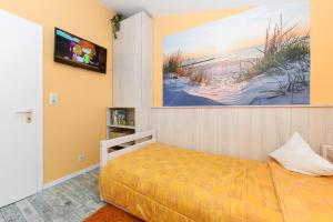 Postel nebo postele na pokoji v ubytování Ferienhaus Nordseeschnecke