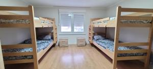 Postel nebo postele na pokoji v ubytování Apartman Progresso