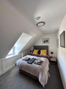 a bedroom with a bed in a attic at Islay Frigate Hotel in Tarbert