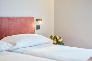 A bed or beds in a room at Residenza Ai Ferrari