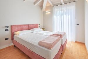 A bed or beds in a room at Residenza Ai Ferrari