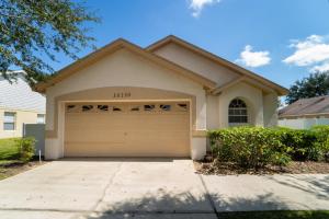 a house with a garage in front of it at 16150EGRET- Sun Chaser (S) in Orlando