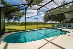 an indoor swimming pool in a building with a tent at 16150EGRET- Sun Chaser (S) in Orlando