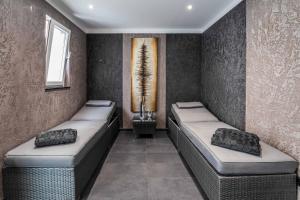 a room with two beds and a window at PLAZA INN Heilbronn in Heilbronn