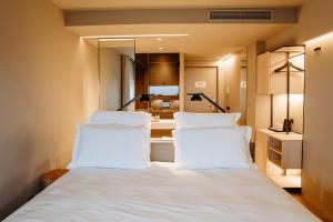 Postel nebo postele na pokoji v ubytování Mercure Fátima