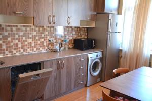 A kitchen or kitchenette at Premium Apartments Baku