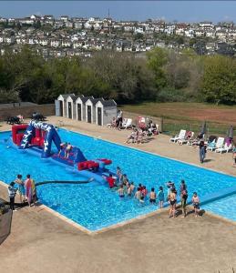 a group of people in a swimming pool at Memories in the making in Paignton