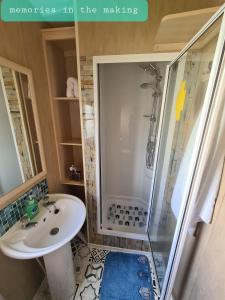 a bathroom with a shower and a sink at Memories in the making in Paignton