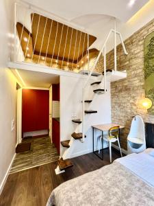 a bedroom with a loft bed and a staircase at Kyiv Art Apartments near Golden Gate in Kyiv