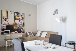 a living room with a couch and a table at Guest House Sicily in Syracuse