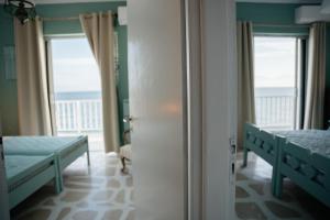 Posteľ alebo postele v izbe v ubytovaní Sea View apartment Dione