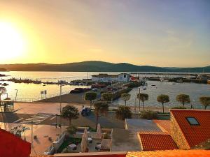 a view of a marina with boats in the water at Hotel Puerto Arnela in Camariñas