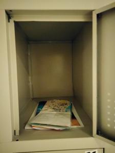 a open cabinet with a book in it at Capsule Hotel Ibedcity in Rovaniemi