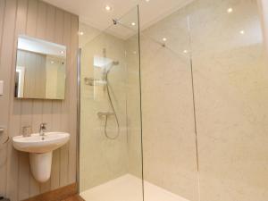 a bathroom with a shower and a sink at Holly Lodge in Preston +11 photos