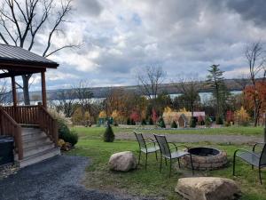 a group of chairs sitting around a fire pit at Single Island Shores in Hector