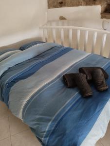 En eller flere senge i et værelse på Moinho Branco (molen)