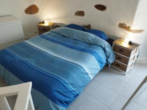 En eller flere senge i et værelse på Moinho Branco (molen)