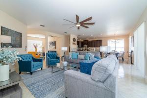 a living room with couches and a dining room at 126NHD - Stevensons Place (G) in Davenport