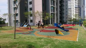 a playground in a building with children playing in it at Damai Homestay Almyra in Kajang